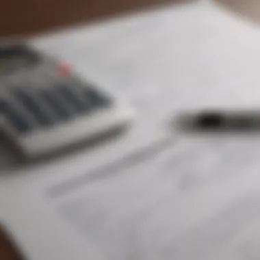 A close-up of mortgage paperwork with a calculator and pen.